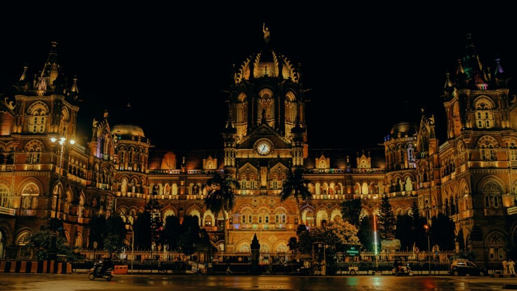 Night view of the iconic Chhatrapati Shivaji Terminus in Mumbai, beautifully lit and historic.