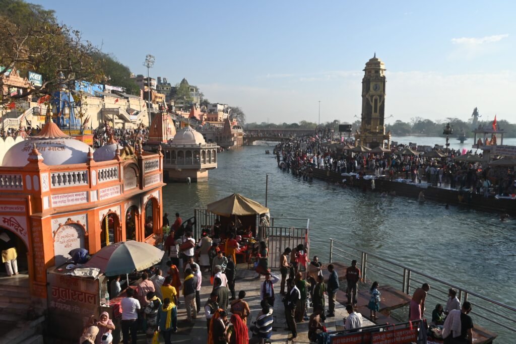 A vibrant scene at the Ganges Ghats in Haridwar during a Hindu festival, showcasing cultural richness.